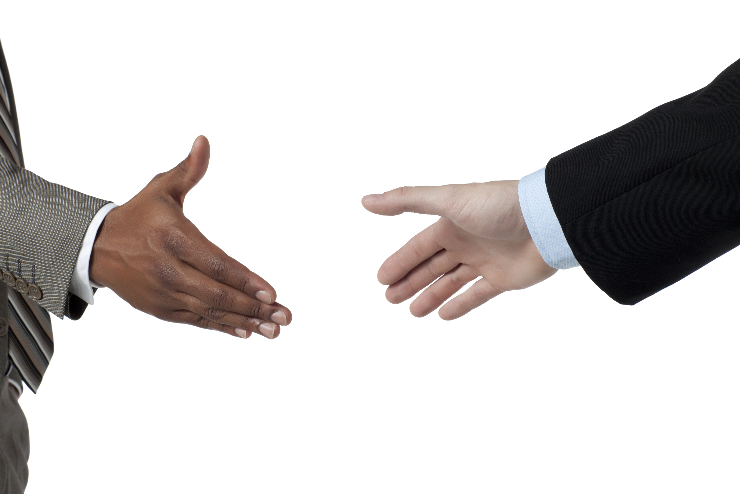 Two business people about to hand shake isolated on a white surface